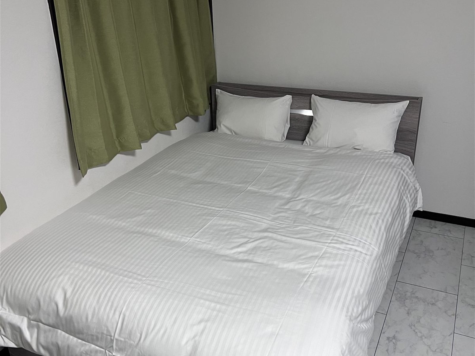 Room 302 with a double bed