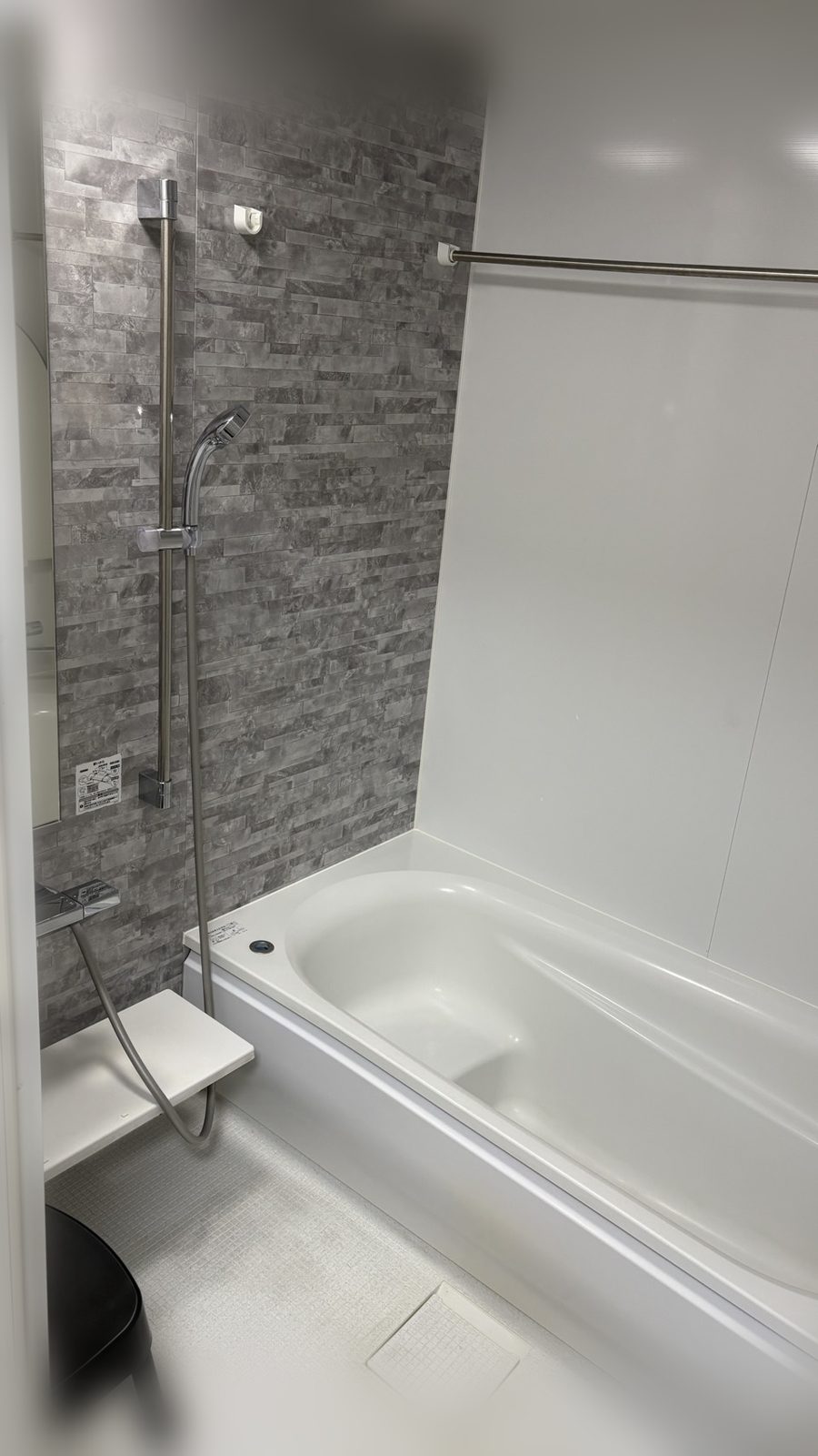 Bathroom with a bathtub and shower in Room 303