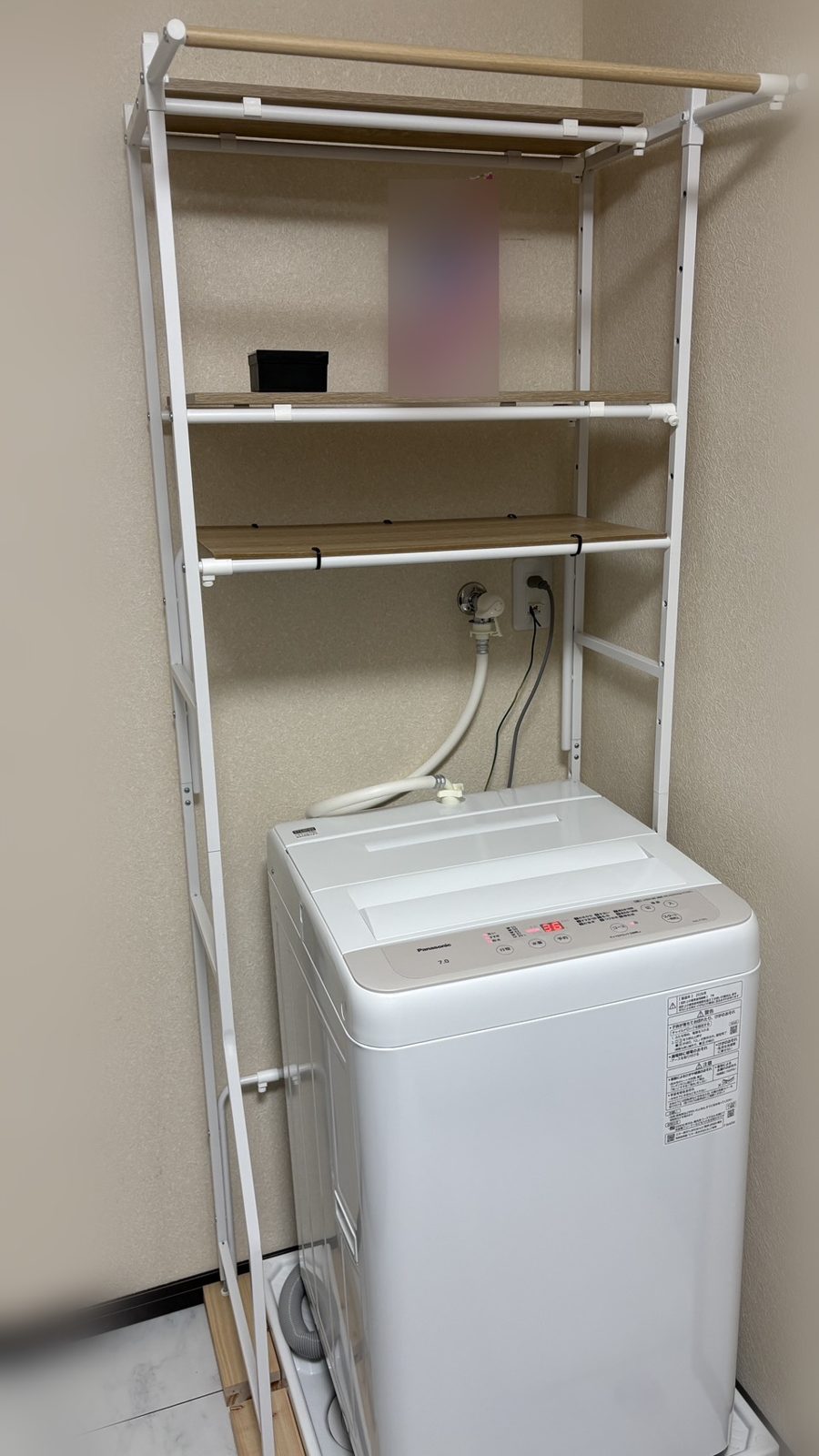 Washing machine with a shelf rack in Room 303